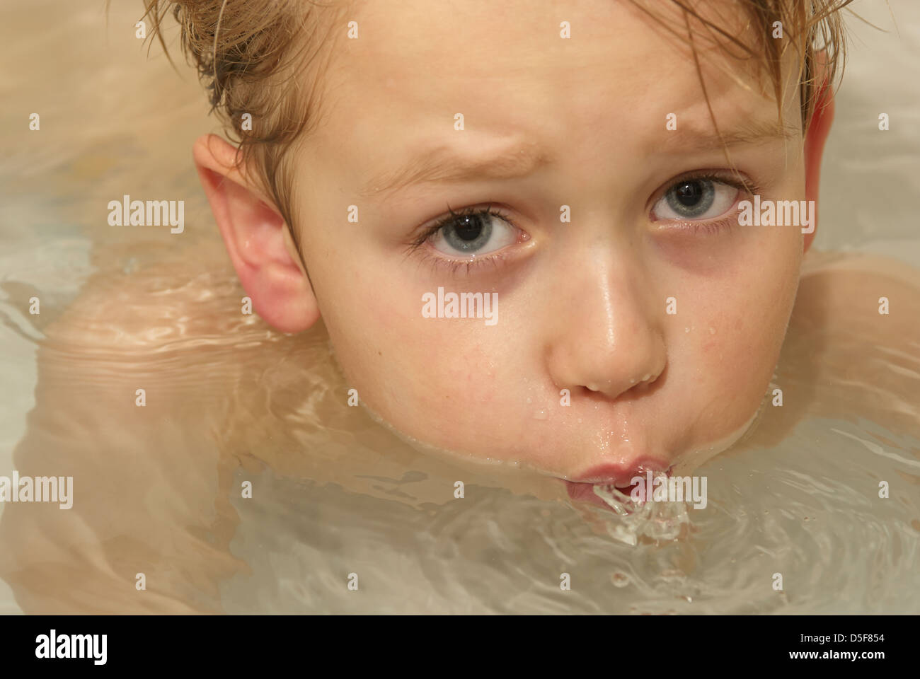 LittleChild Blond Boy Floating in Bathtub Stock Photo Alamy