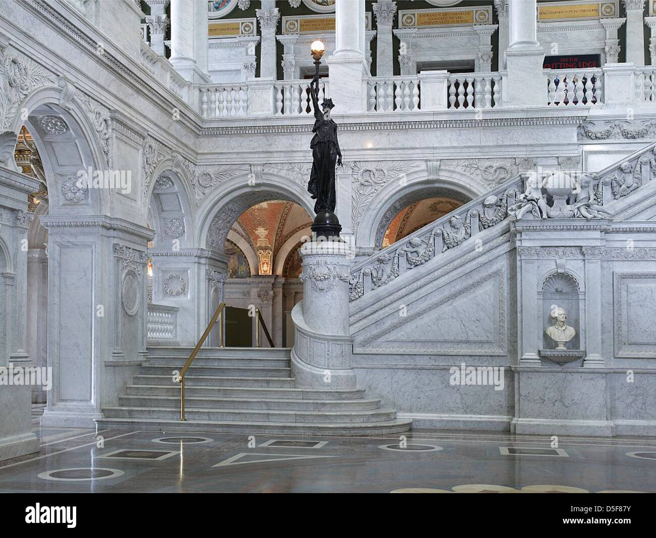 [Great Hall. View of grand staircase and bronze statue of female figure on newel post holding a torch of electric light, with bust of Thomas Jefferson at right. Library of Congress Thomas Jefferson Building, Washington, D.C.] (LOC) Stock Photo
