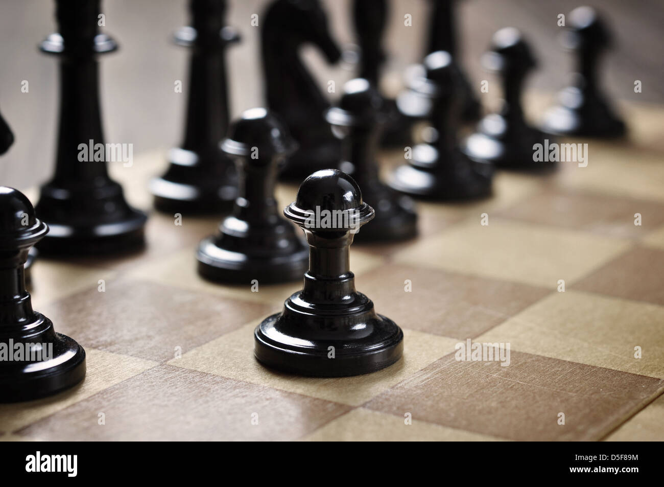 chess pieces on a wooden desk closeup Stock Photo
