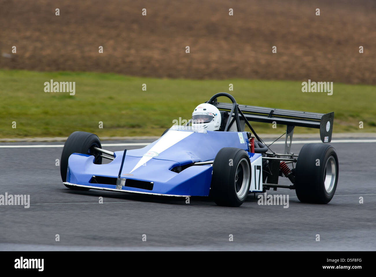 A car racing around Castle Combe Circuit at the Bristol Motor Club's ...