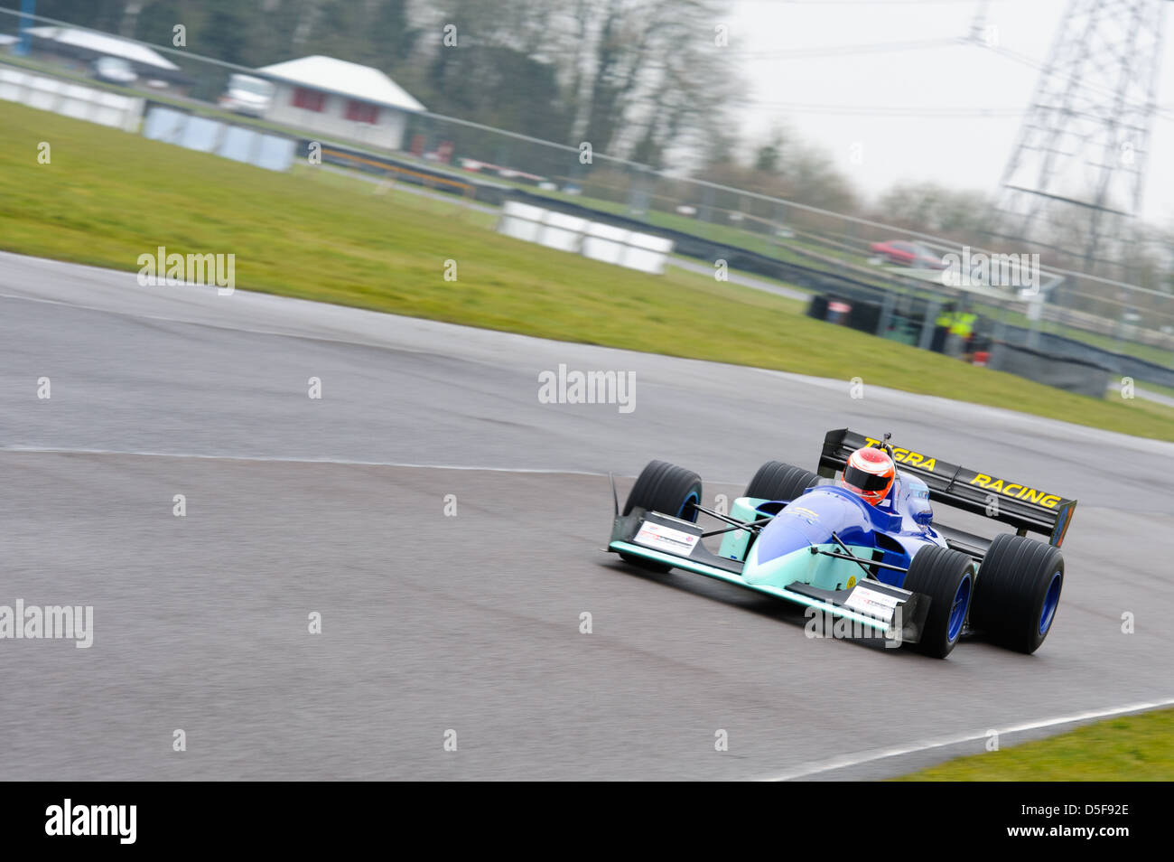 A car racing around Castle Combe Circuit at the Bristol Motor Club's ...
