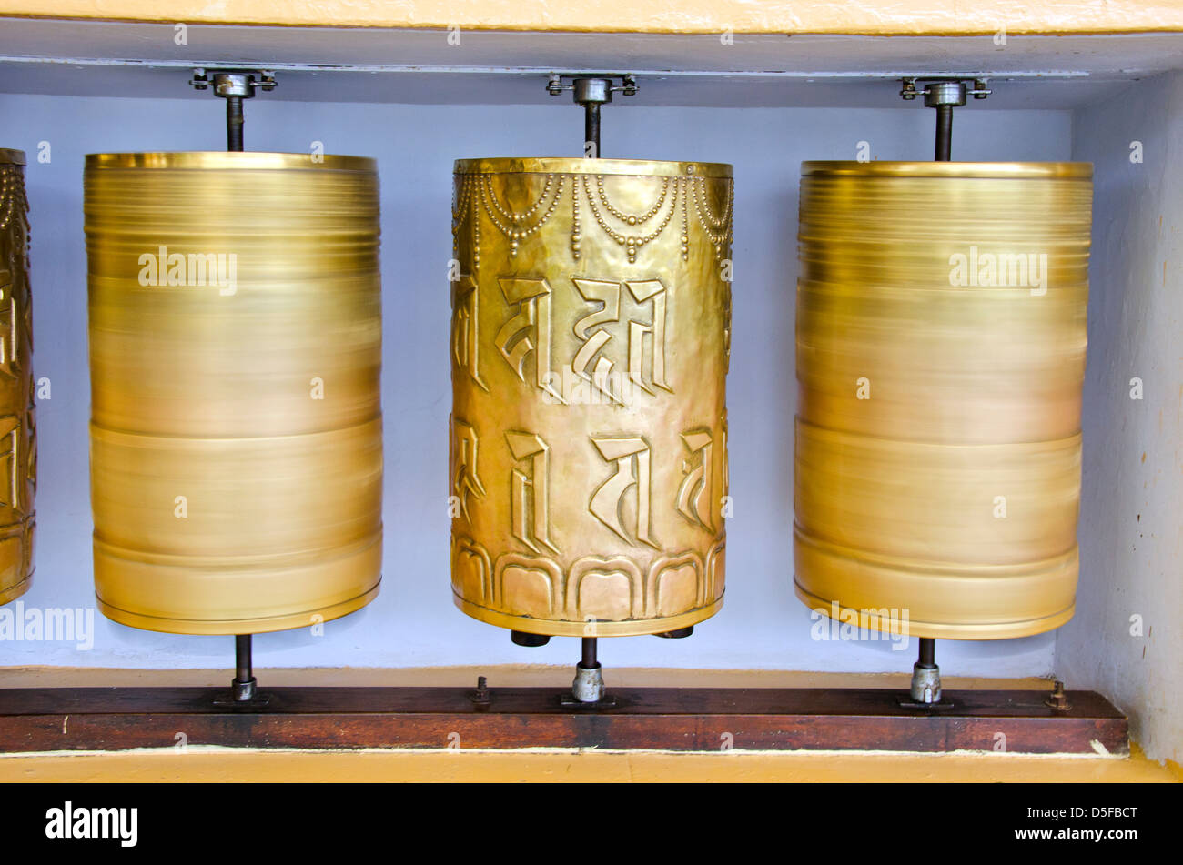 tibetan Buddhist prayer brass wheels in McLeod Ganj temple, India Stock Photo