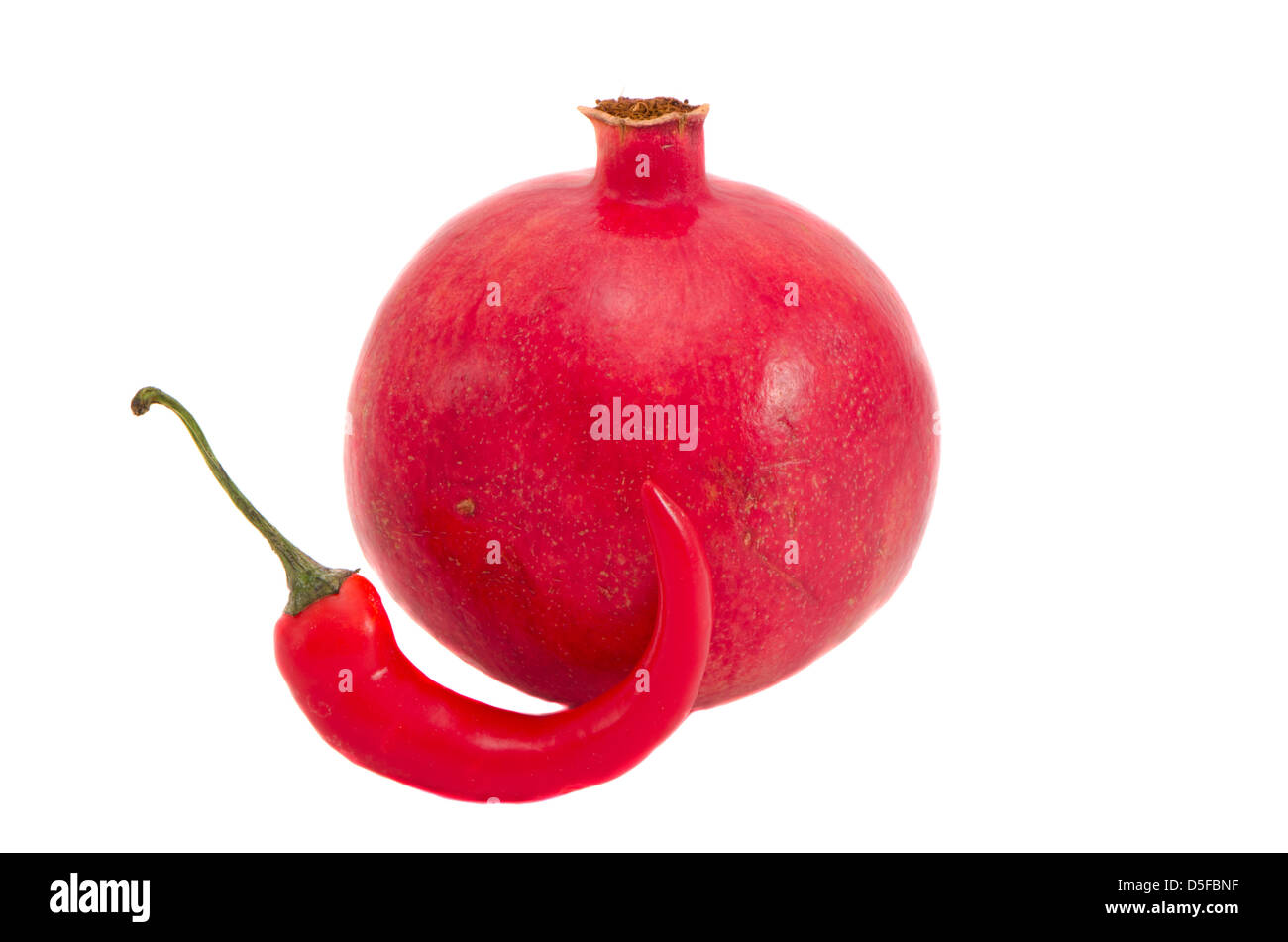 pomegranate and red hot pepper isolated on white background Stock Photo