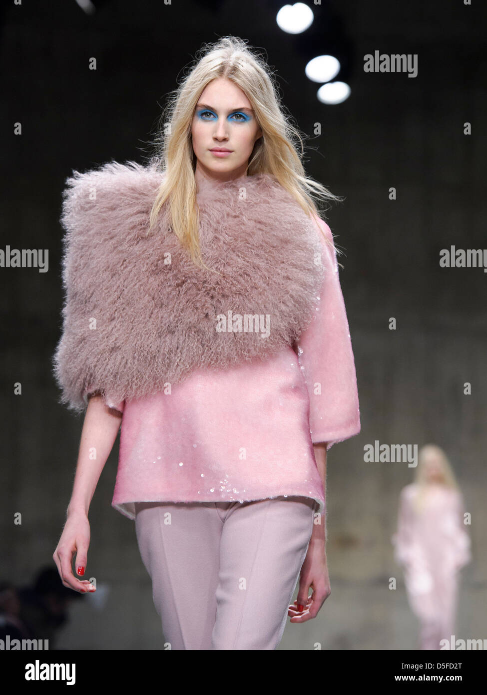 A model wears a design from the Unique collection during London Fashion Week. Stock Photo