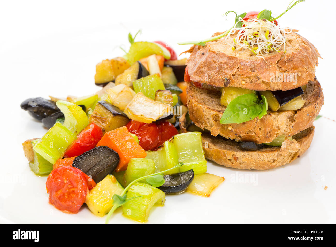 Steamed vegetables and rye bread on white background Stock Photo - Alamy