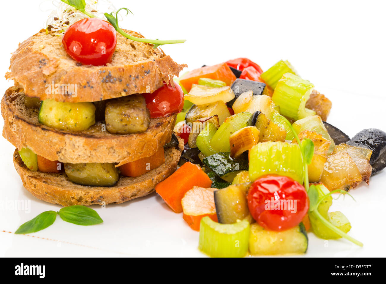 Steamed vegetables and rye bread on white background Stock Photo - Alamy