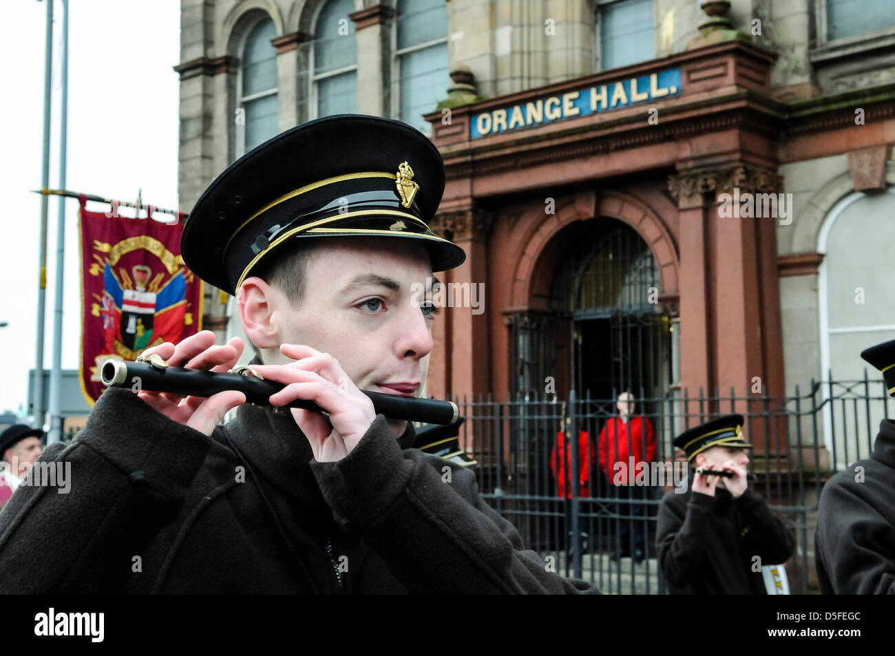 Belfast, Northern Ireland. 1st April 2013. A band member plays a flute outside Clifton Street Orange Hall. Credit Stephen Barnes / Alamy Live News Stock Photo