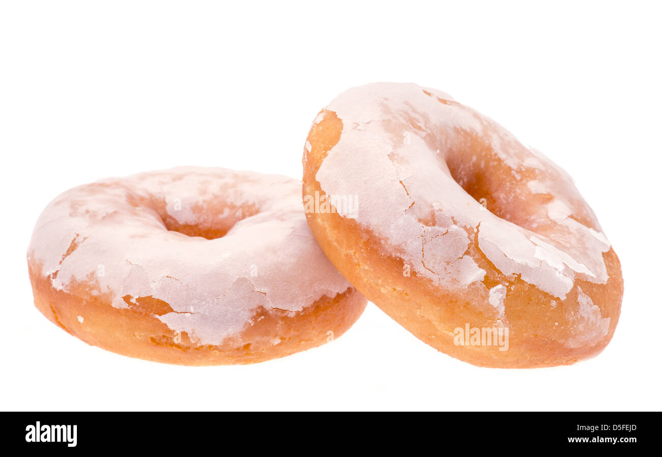 Two white glazed ring donuts - studio shot with a white background Stock Photo