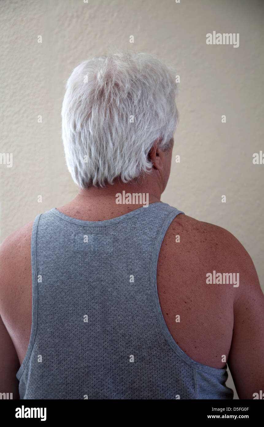 Man With Silver Hair and Vest Stock Photo