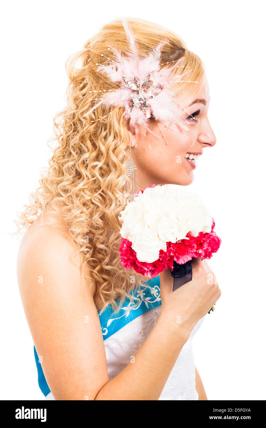 Profile view of beautiful bride smiling with wedding bouquet, isolated on white background Stock Photo