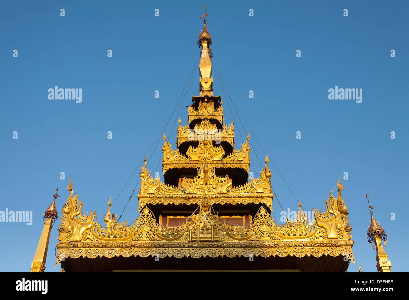 Ornate roof of a prayer hall at Shwedagon Pagoda, Yangon (Rangoon), Myanmar, (Burma) Stock Photo