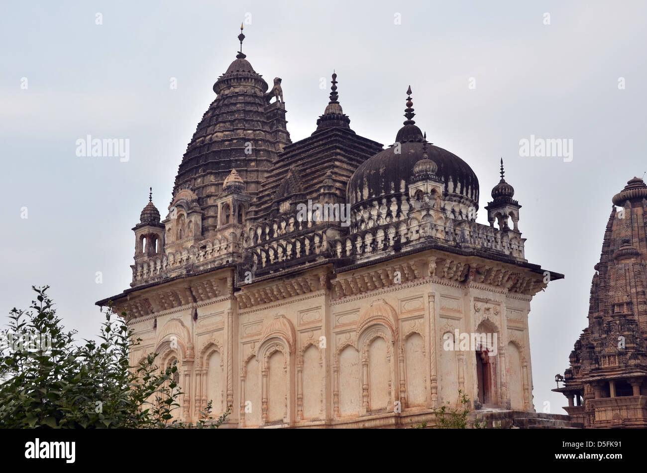 Parvati temple, Khajuraho. This temple has a Hindu spire, a Jain cupola, a Buddhist Stupa and a Muslim style Dome, Stock Photo