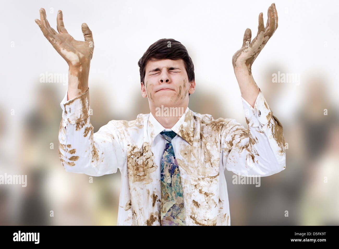 Young man raising dirty hands to heaven. Stock Photo