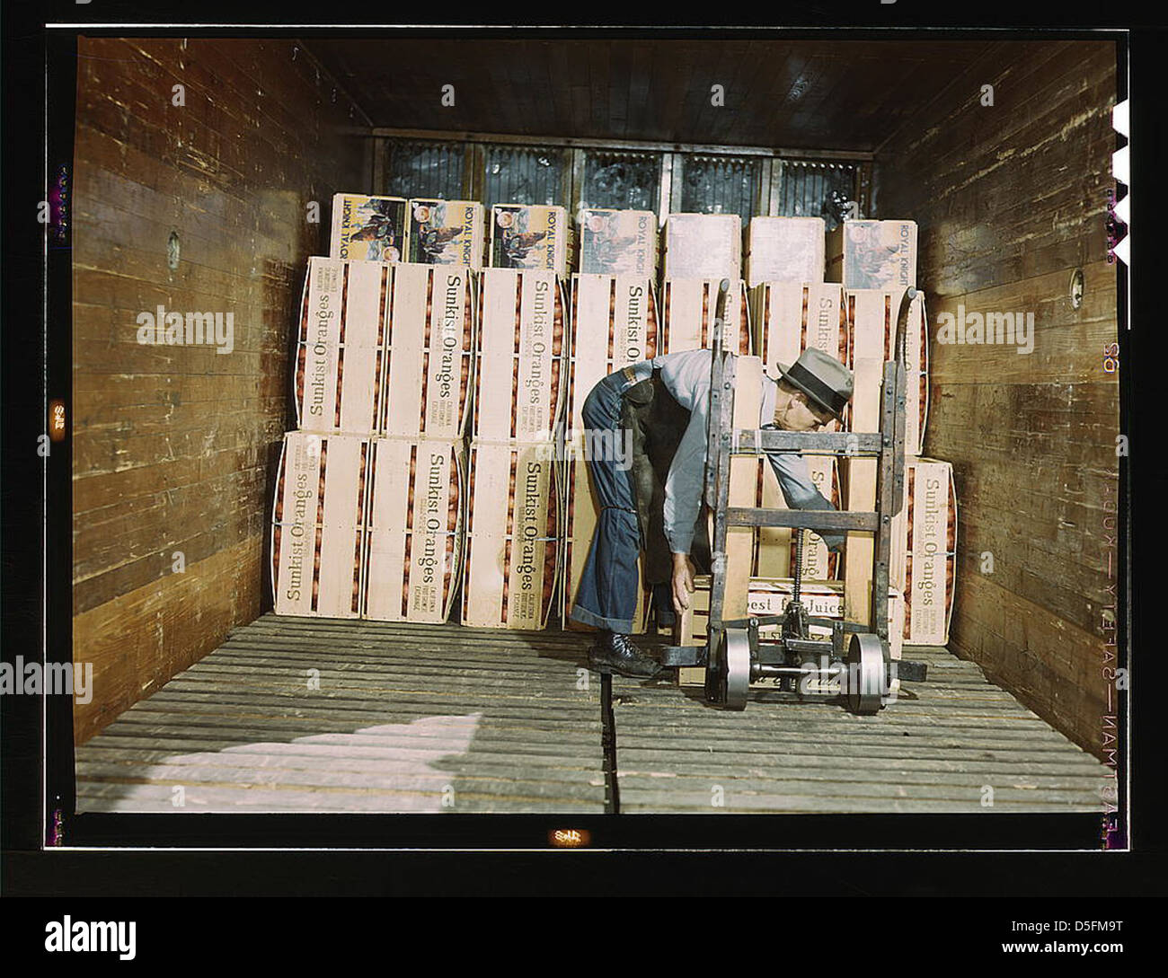 Loading oranges into a refrigerator car at a co-op orange packing plant, Redlands, Calif. Santa Fe R.R. trip (LOC) Stock Photo