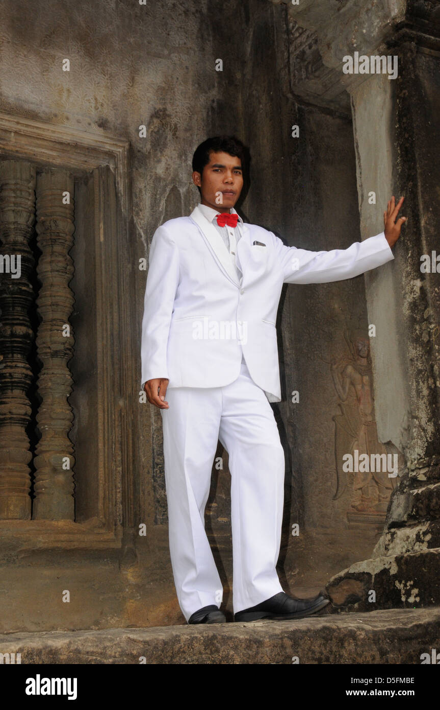 Young groom on wedding day in front of main temple, Angkor Wat, khmer architecture Stock Photo