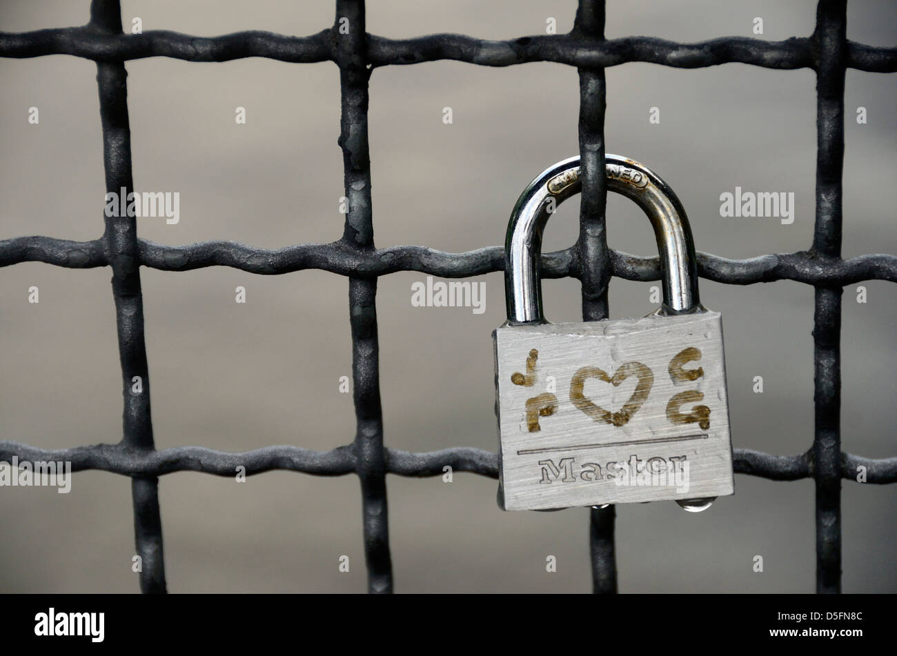 'Love padlocks' on a bridge in Riva del Garda, Italy. Stock Photo
