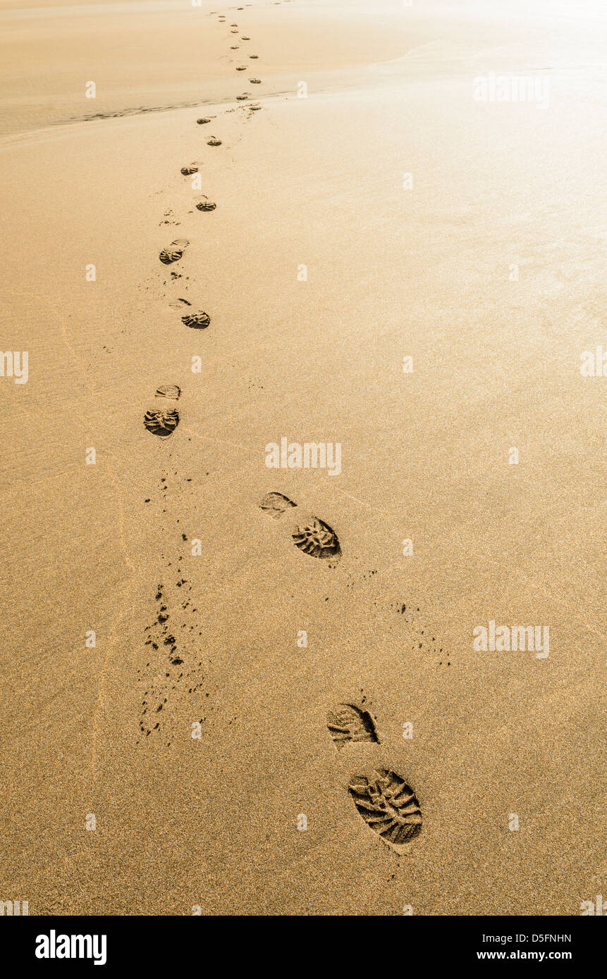 Footprints on a sandy beach. Stock Photo