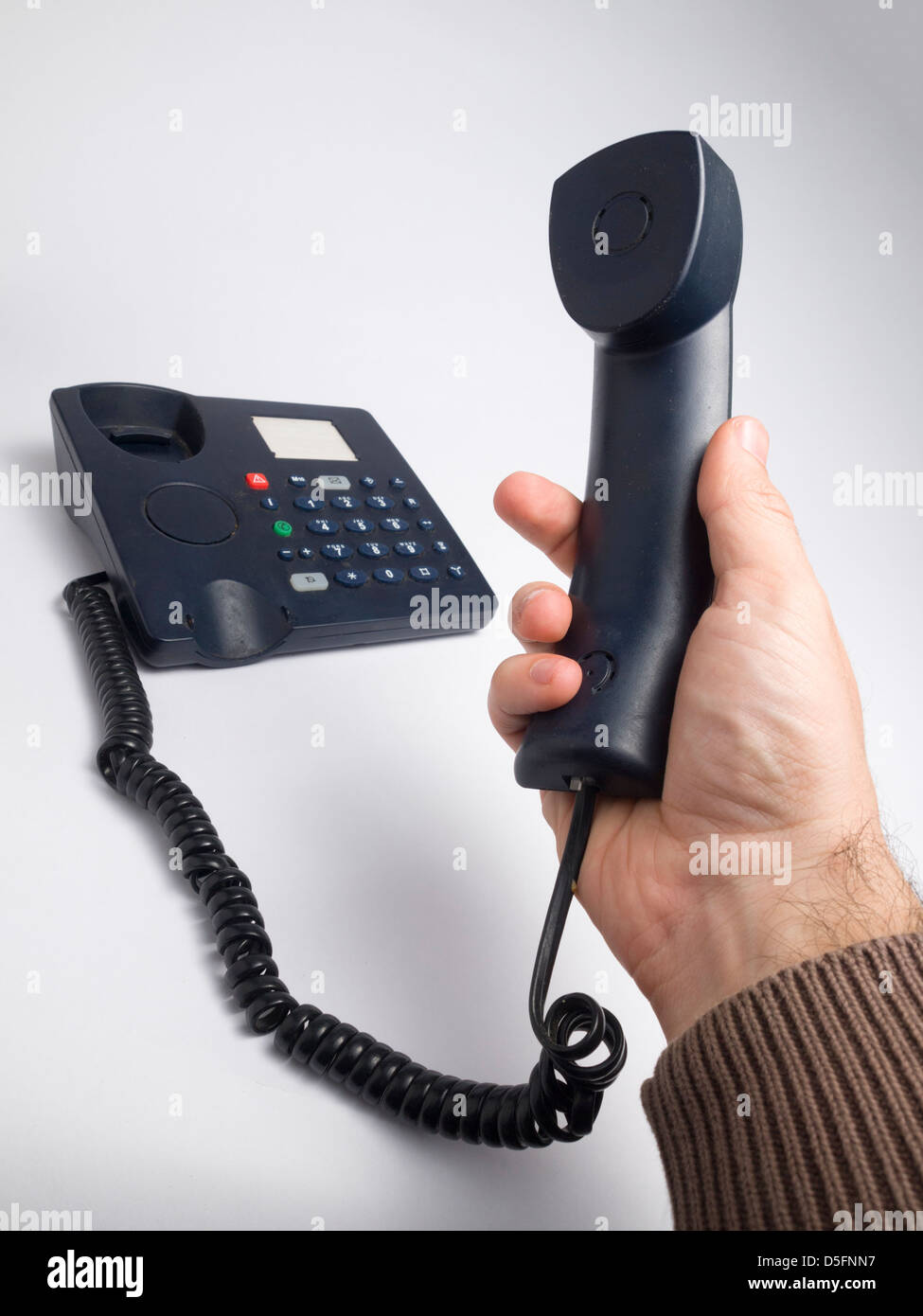 Hand holding telephone receiver Stock Photo Alamy