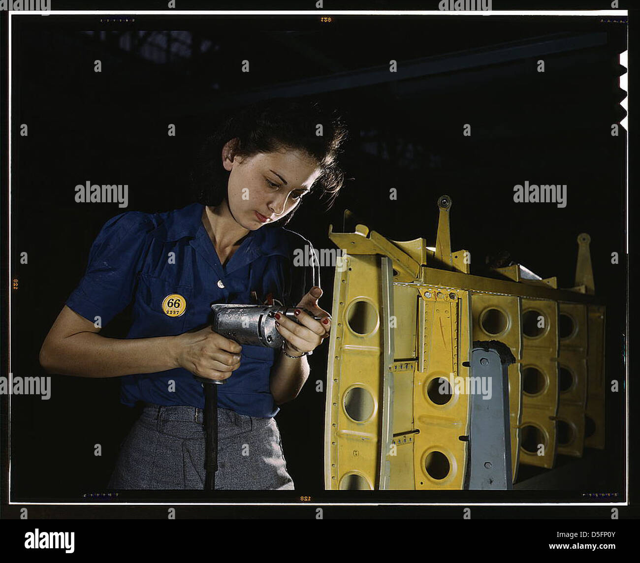 Drilling horizontal stabilizers: operating a hand drill, this woman worker at Vultee-Nashville is shown working on the horizontal stabilizer for a Vultee 'Vengeance' dive bomber, Tennessee. The 'Vengeance' (A-31) was originally designed for the French. It Stock Photo