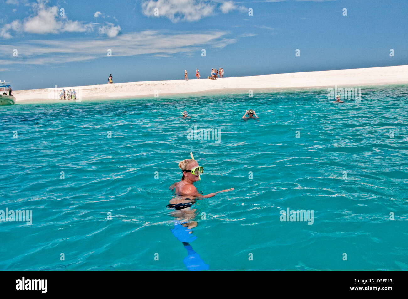 Girl snorkling near castaway island. Known from the movie Castaway with Tom Hanks, Monuriki island in the Manamuca island group. Stock Photo