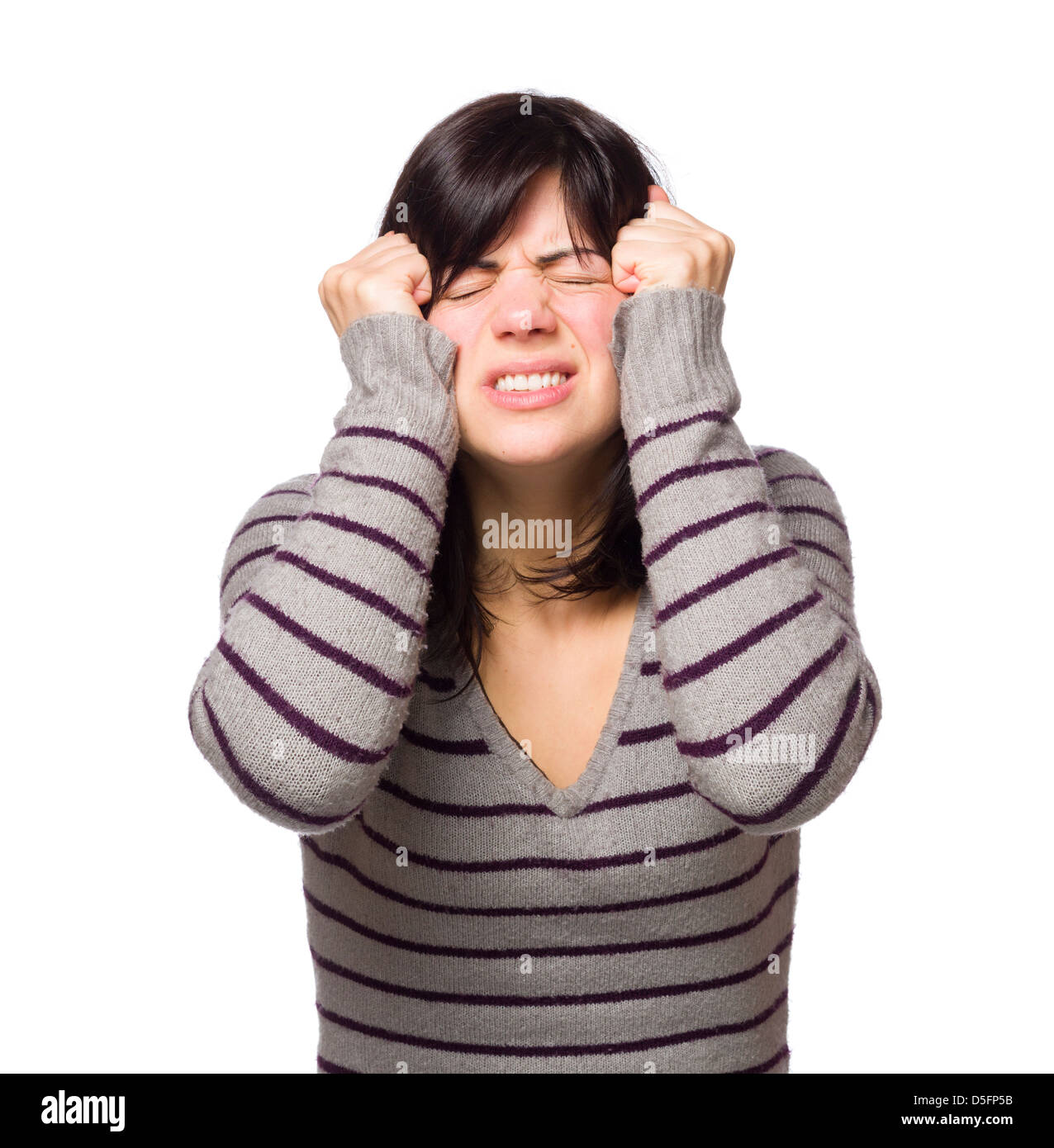 Frustrated young woman grimacing isolated on white background Stock Photo