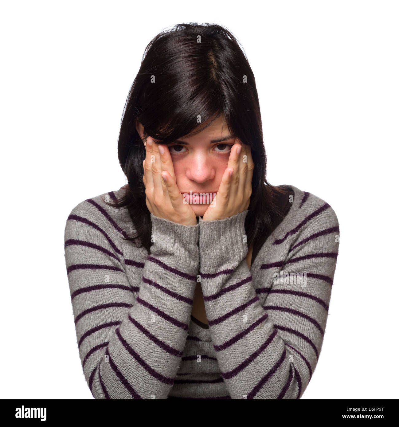 Portrait of sad young woman with hands covering face Stock Photo