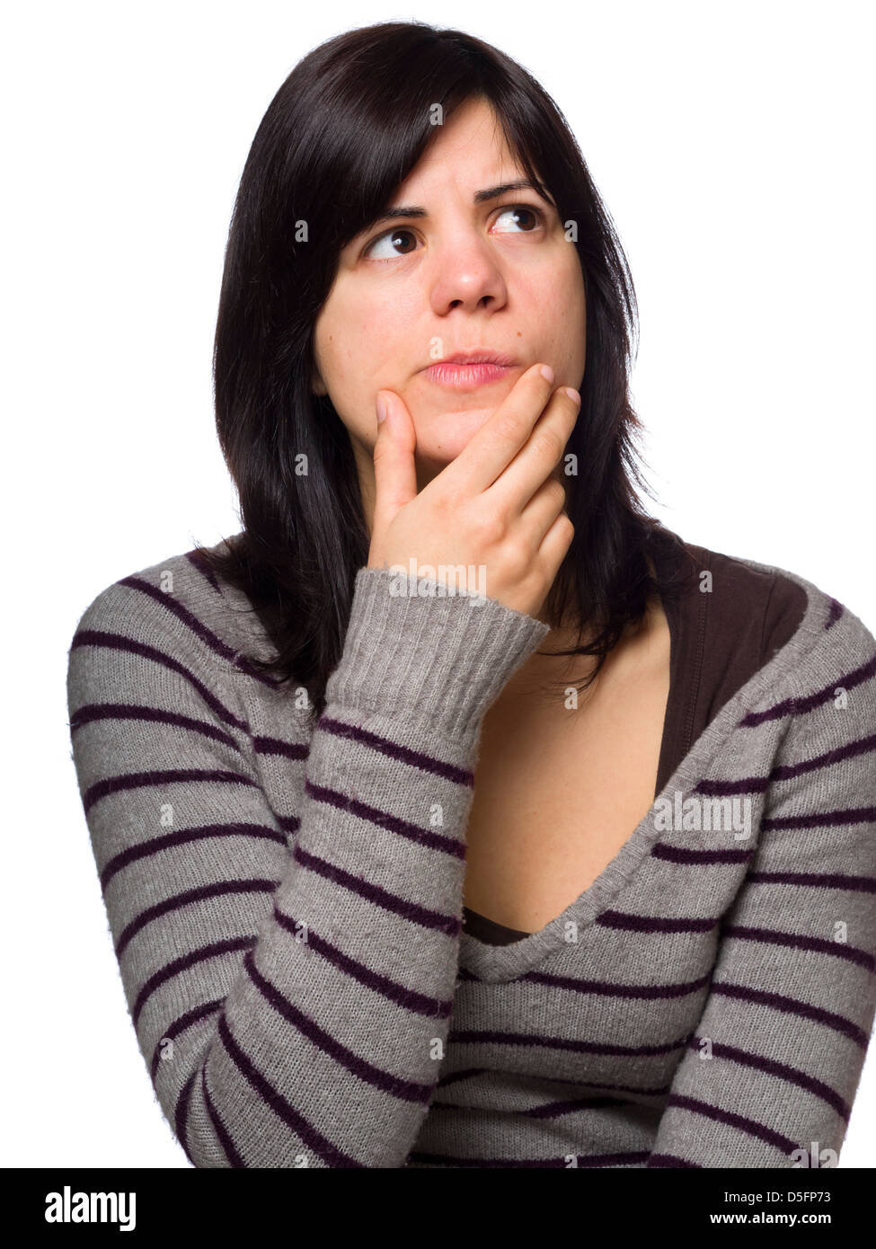 Portrait of pensive young woman with hand on chin isolated on white background Stock Photo