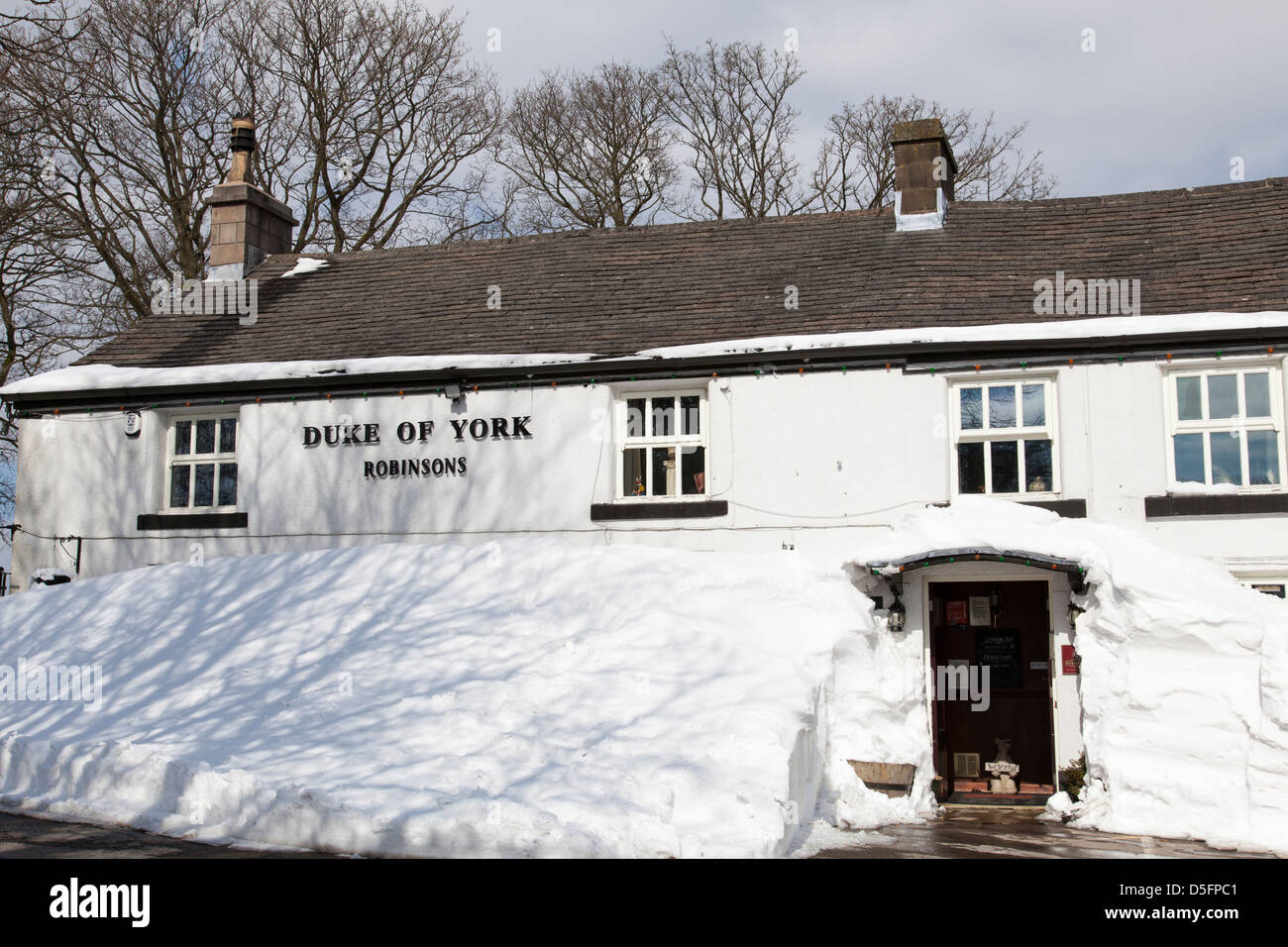 Snow drifts cover the Duke of York public house in Pomeroy, Derbyshire, England, U.K. Stock Photo