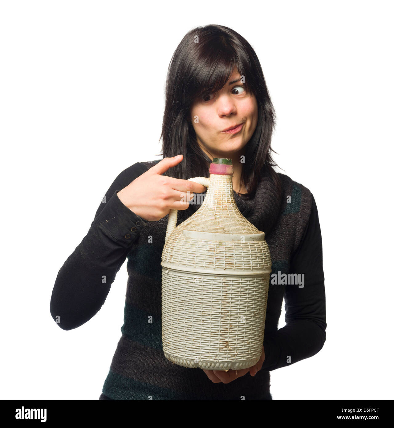 Drunk woman smiling while holding wine carboy and making a funny face isolated on white background Stock Photo