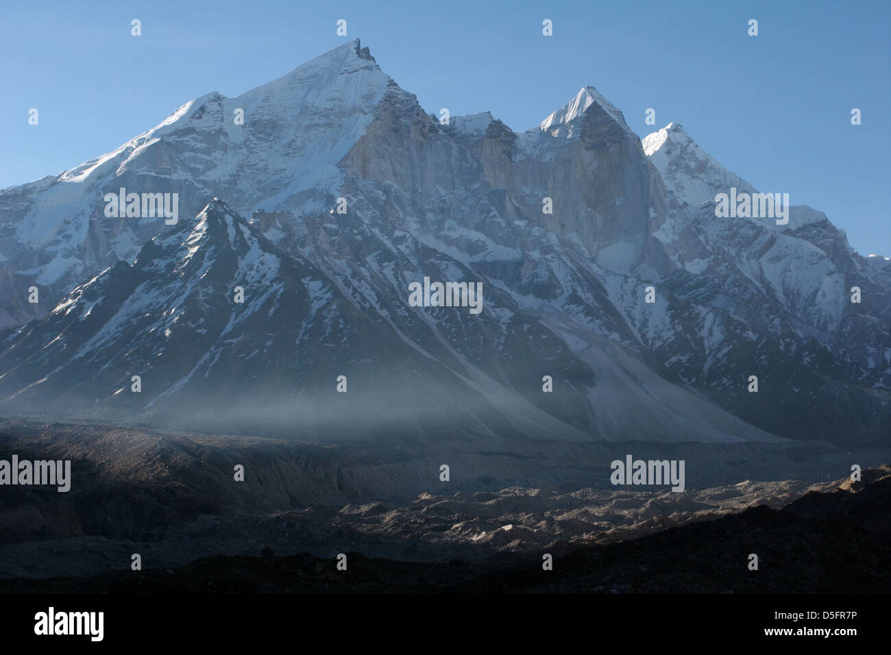 The three Bhagirathi peaks in the Garhwal Himalaya, the Gangotri Glacier in the foreground. Stock Photo