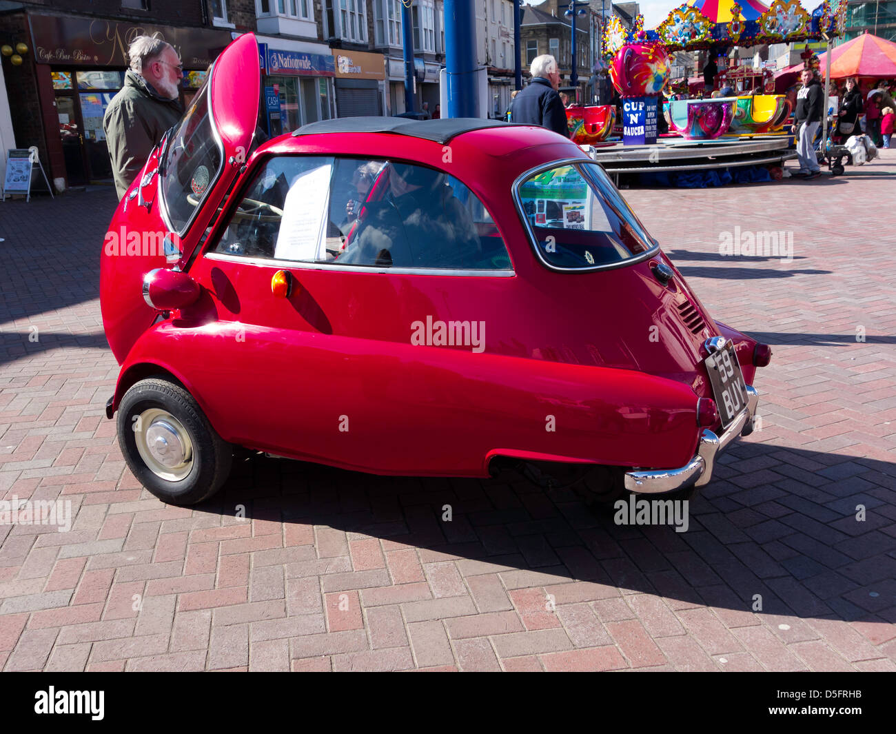 A beautifully restored BMW Isetta bubble car on display in Redcar High Street March 2013 Stock Photo