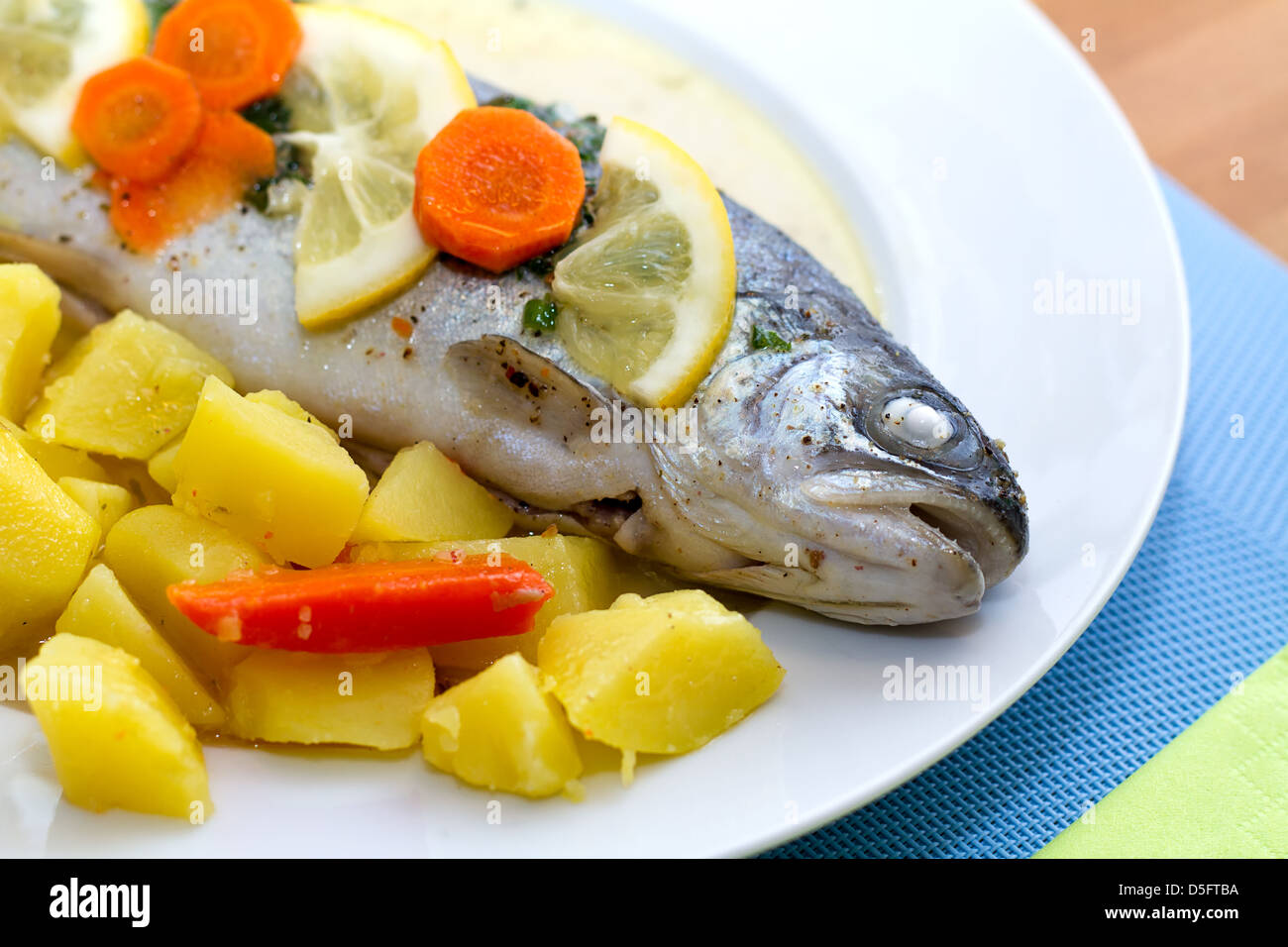 Trout fish with lemon slices and boiled potatoes Stock Photo Alamy