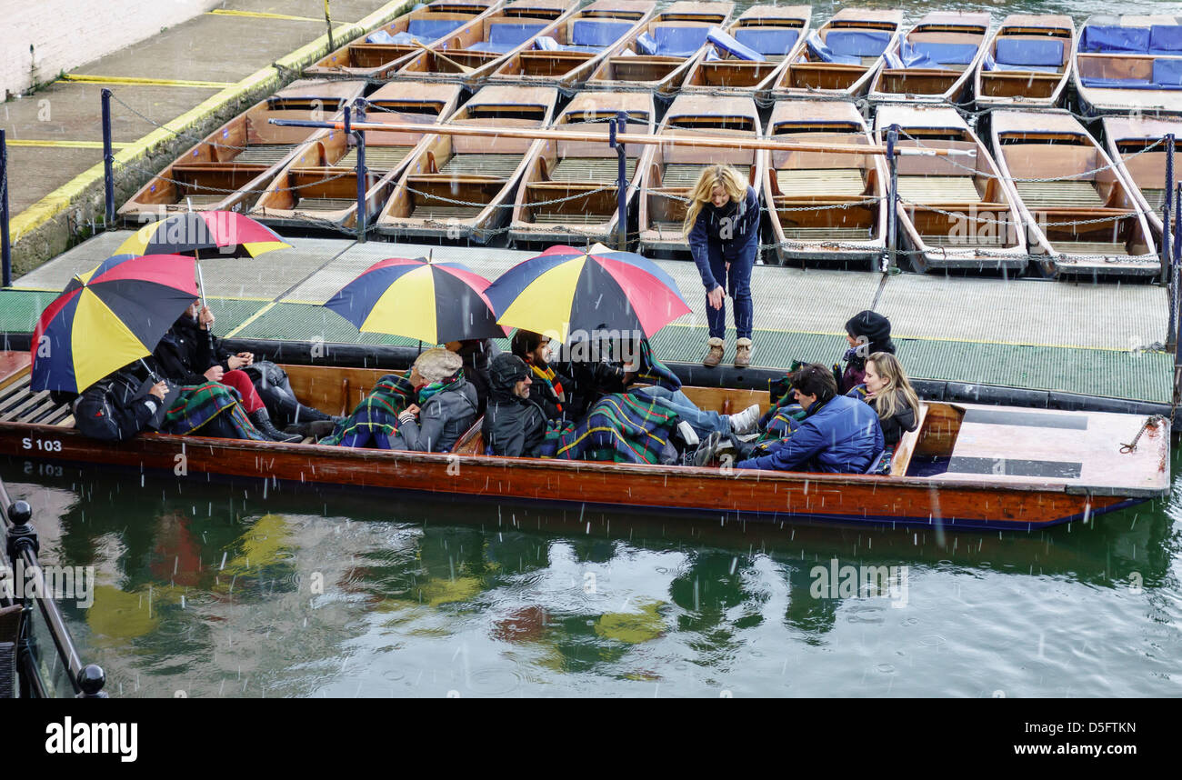 Punting on the River Cam in the snow. Cambridge England Stock Photo