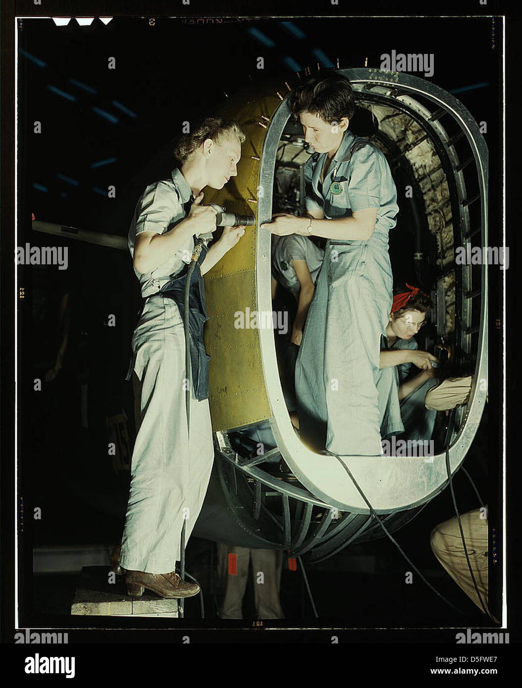 Riveters at work on fuselage of Liberator Bomber, Consolidated Aircraft Corp., Fort Worth, Texas (LOC) Stock Photo