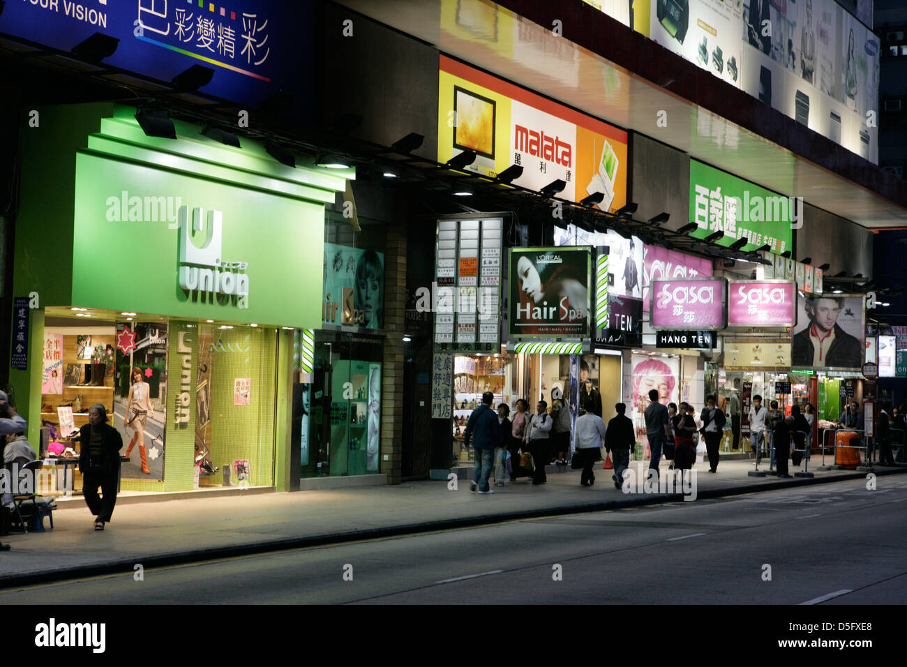 Neon shop signs lit up at night in Mong Kok, Hong Kong, Asia Stock