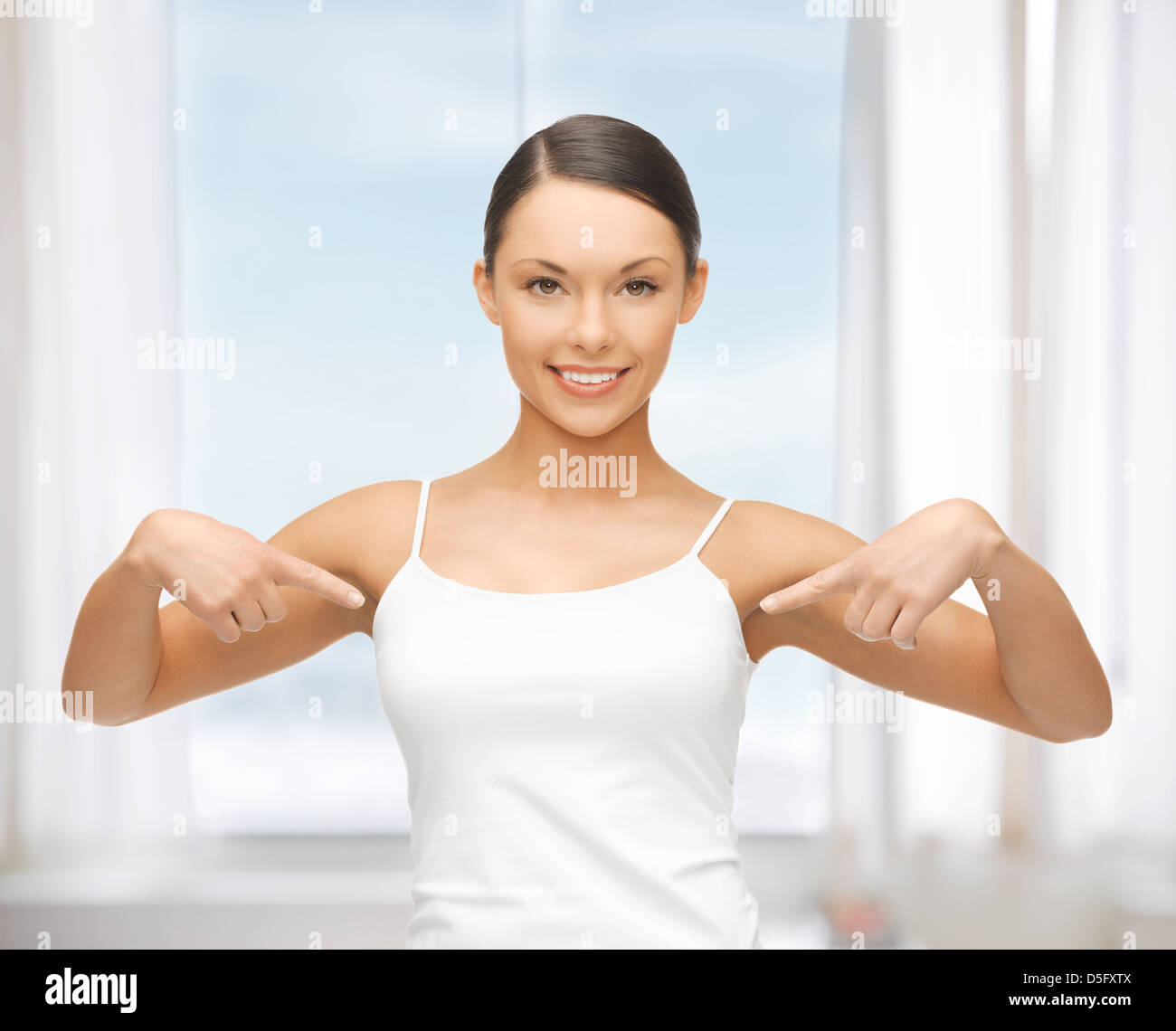 woman in blank white tshirt pointing at herself Stock Photo Alamy