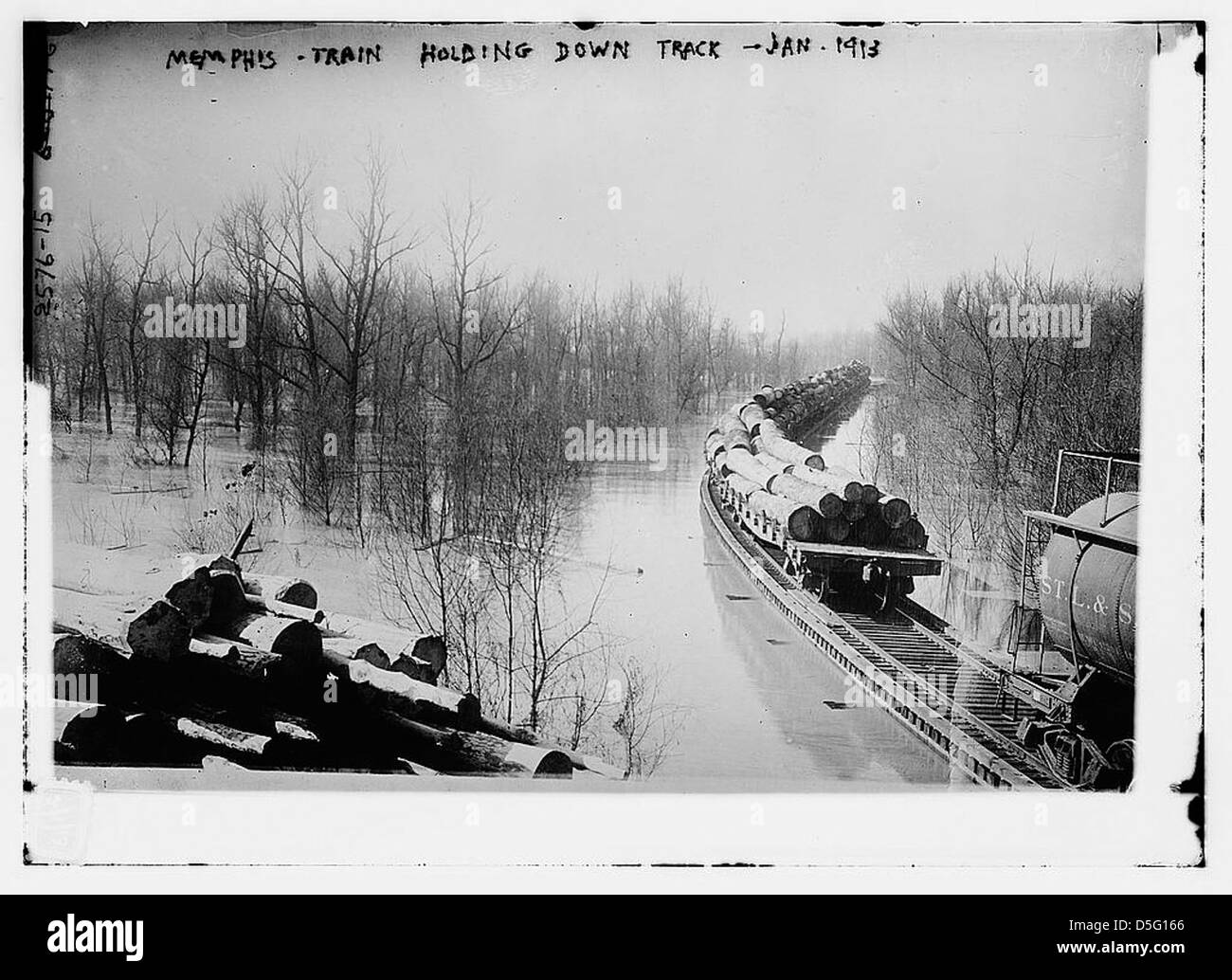 This photograph from January 1913 depicts a train holding down a ...