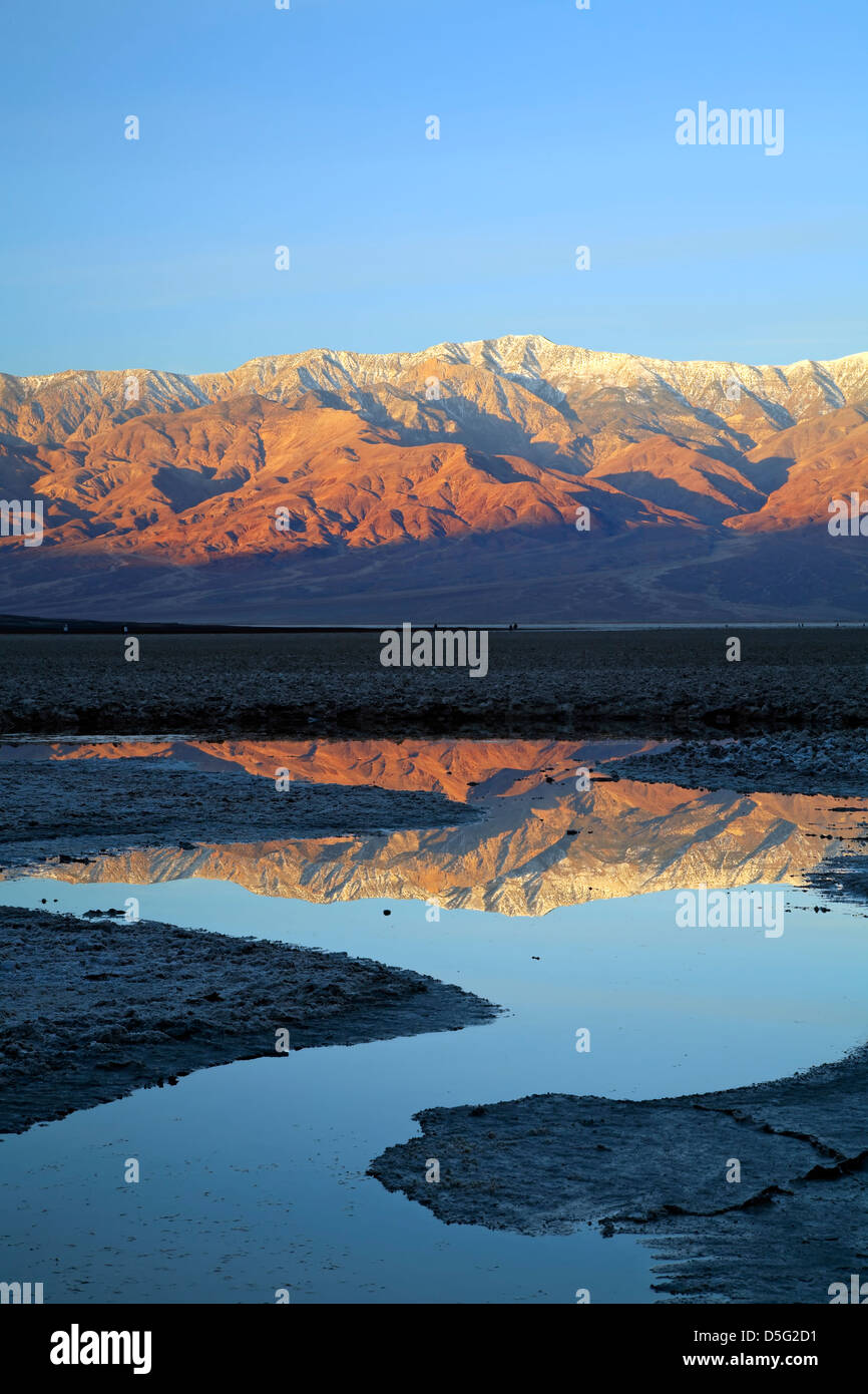 Telescope Peak (11,049 ft.) and Panamint Range reflected on pond, Badwater Basin, Death Valley National Park, California USA Stock Photo