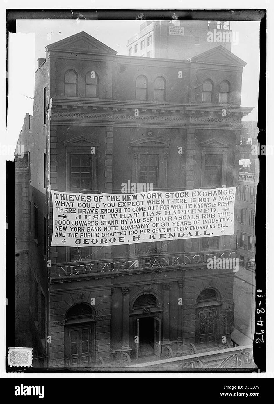 A 20th-century notice from the New York Bank Note Company, featuring a building banner along Sixth Avenue, symbolizing capitalism and the financial sector in New York City during that period. Stock Photo