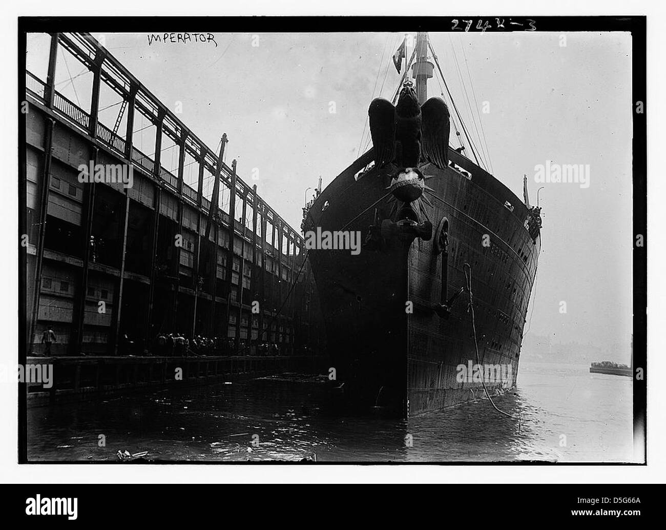 A photograph of the RMS Imperator, an ocean liner built by AG Vulcan for the Hamburg-Amerikanische Packetfahrt-Actien-Gesellschaft (HAPAG), later known as the RMS Berengaria. The image highlights its role as a transatlantic passenger ship. Stock Photo