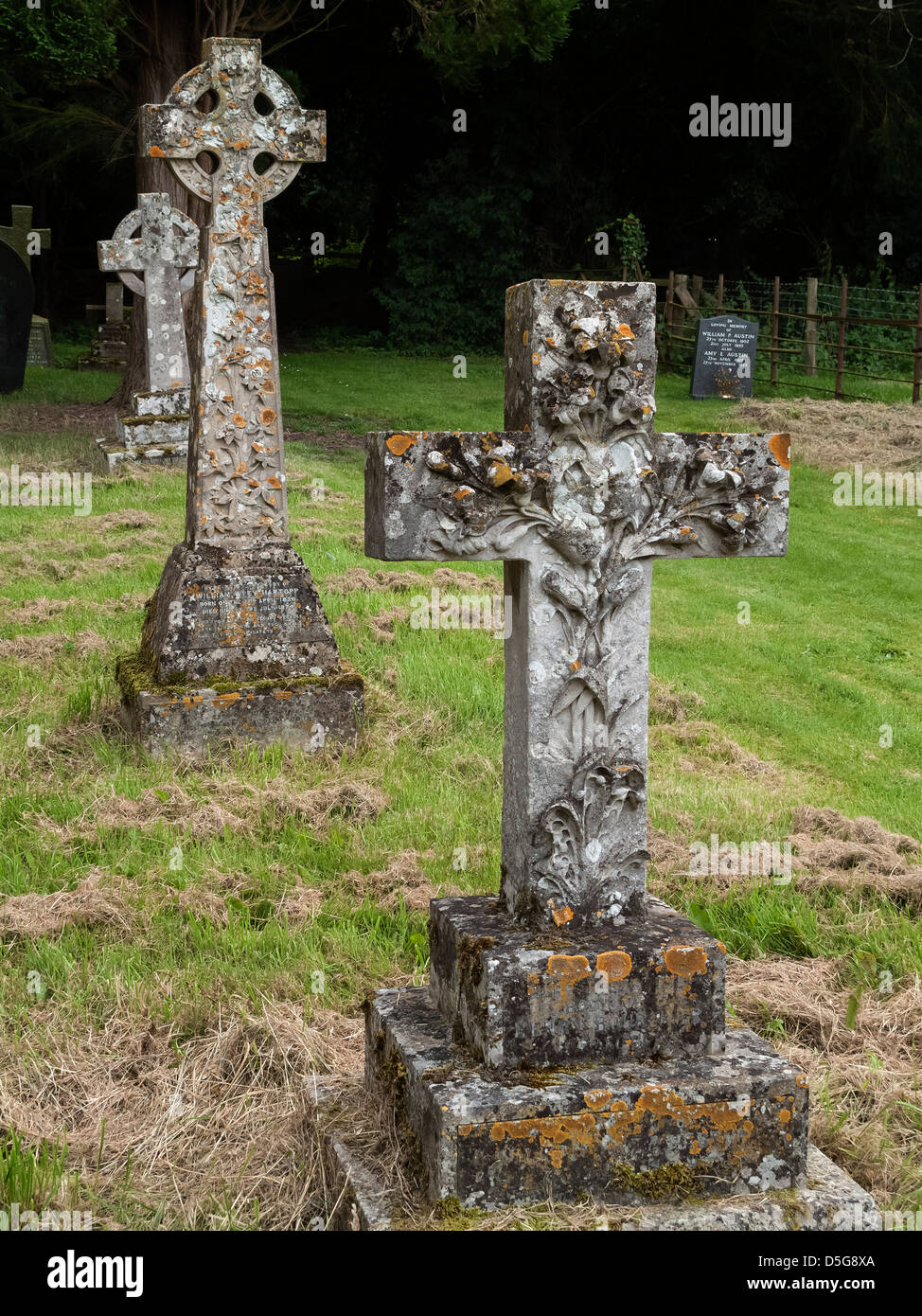 Old gravestone crosses in churchyard of St James Church, Little Dalby, Melton Mowbray, Leicestershire, England, UK Stock Photo