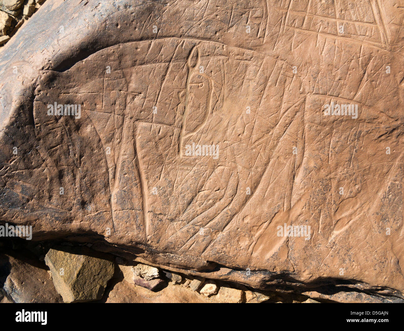 Prehistoric rock carvings at Oued Mestakou on the Tata to Akka road in Morocco. Stock Photo