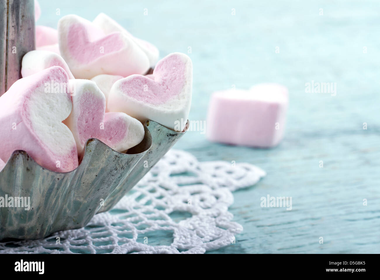 Heart shaped marshmallows in a metal cupcake Photograph by Anna