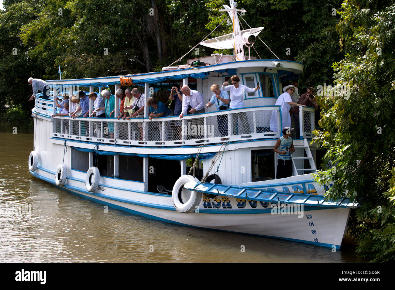 Tourists fishing piranha on Amazon river near Santarem, Brazil Stock Photo