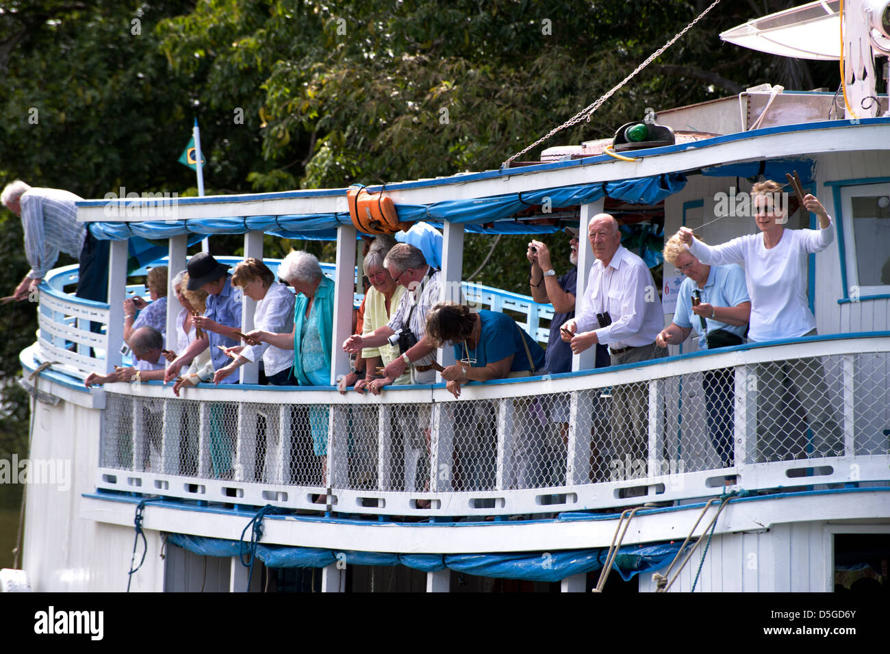 Tourists fishing piranha on Amazon river near Santarem, Brazil Stock Photo