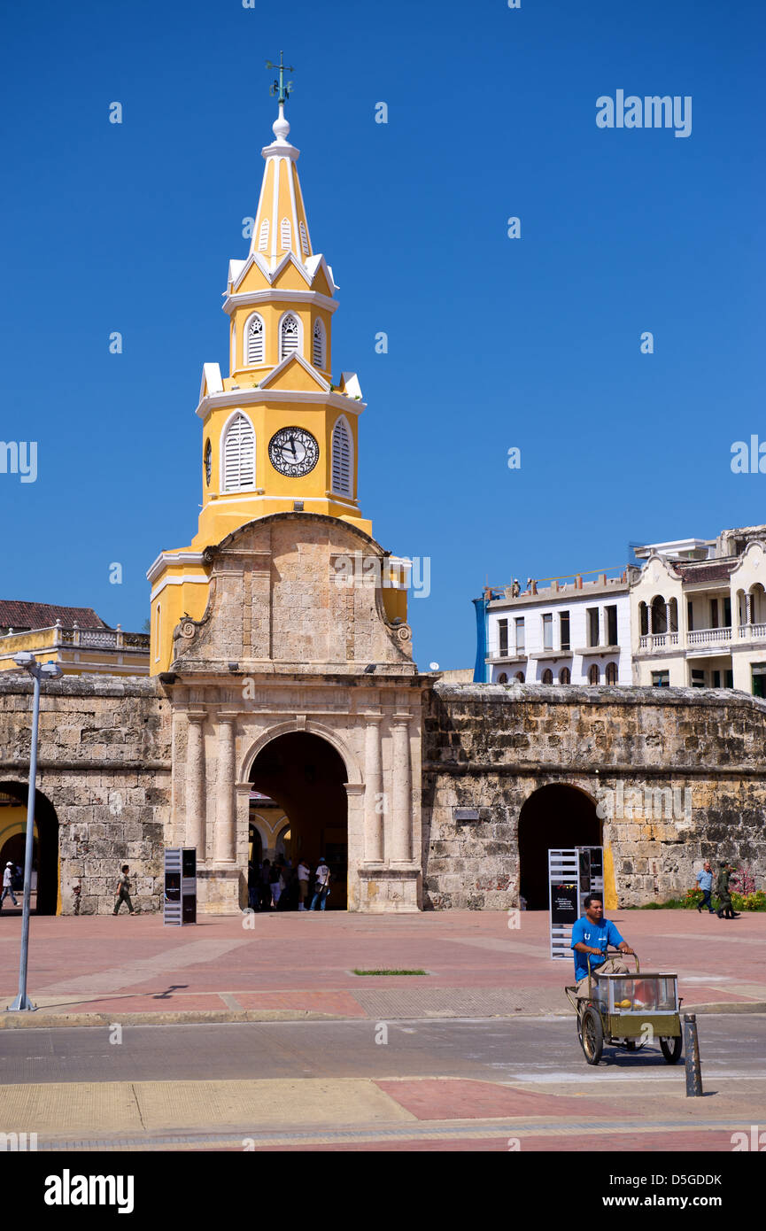 Clock Tower in Cartagena, Colombia, taken hot sunny day with local seller in the foreground Stock Photo