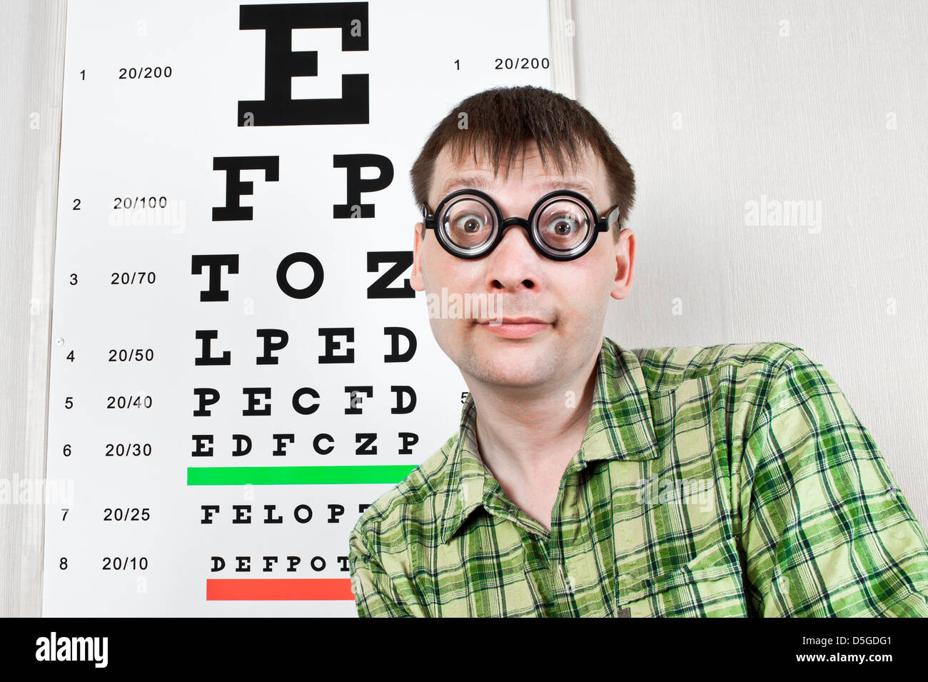 person wearing spectacles in an office at the doctor Stock Photo
