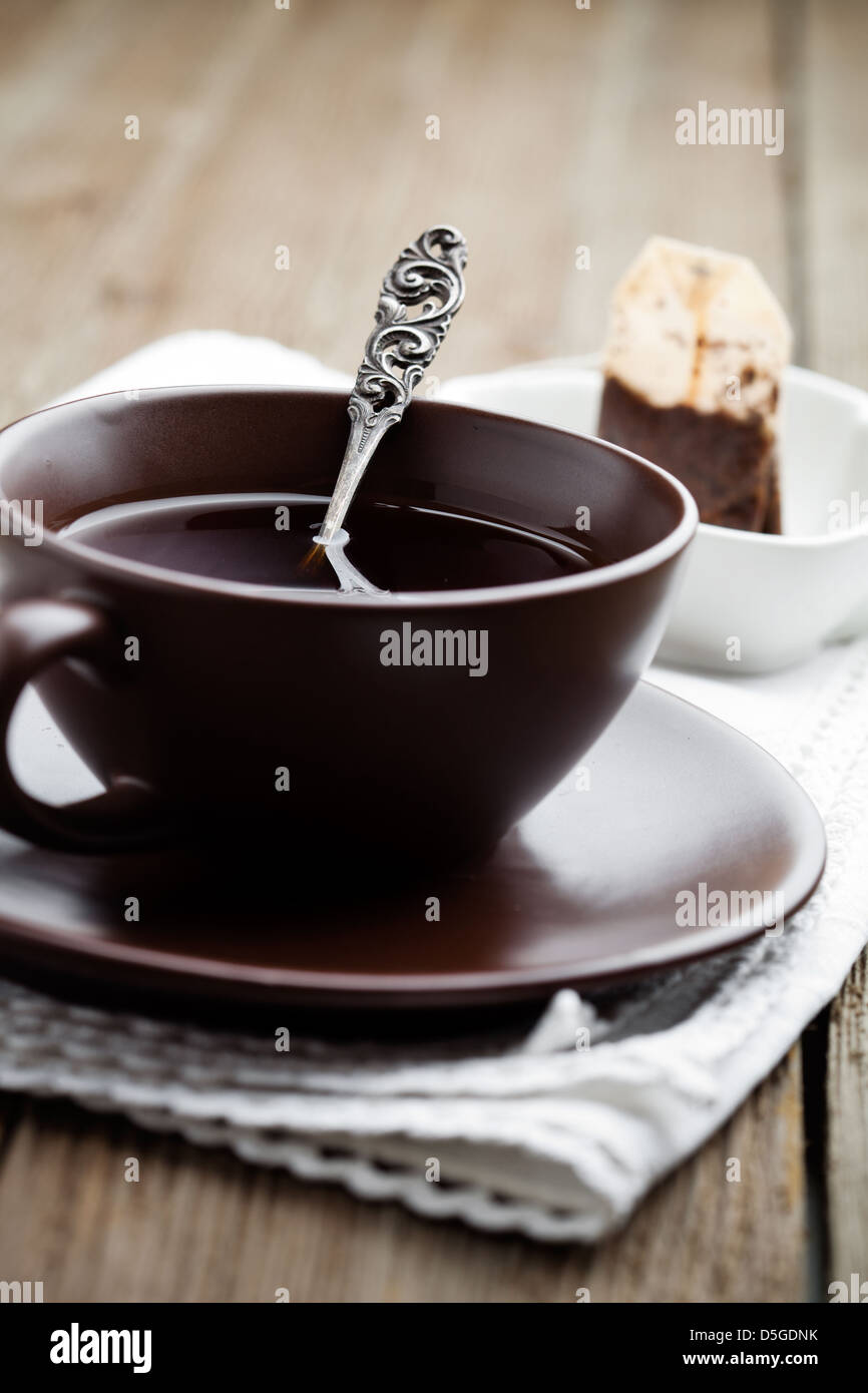Fresh tea in brown cup, selective focus Stock Photo