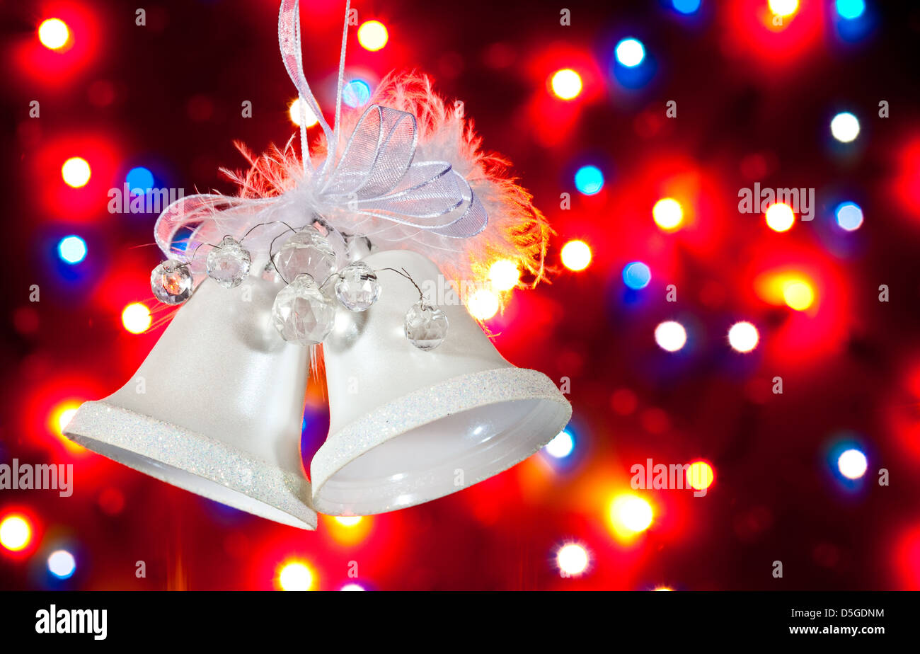 Two white handbells on the multicolour background Stock Photo