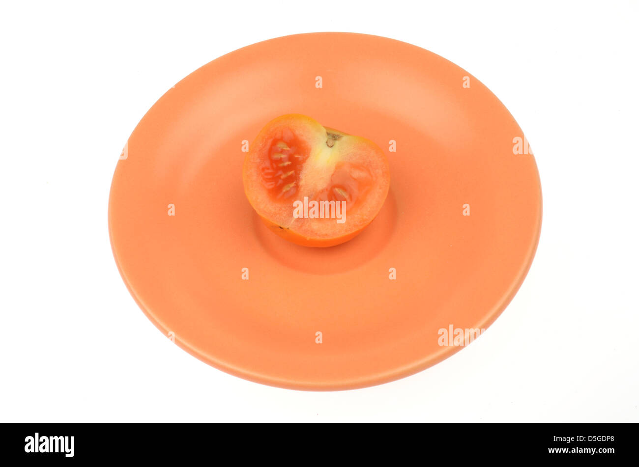 tomato cut on saucer orange Stock Photo Alamy